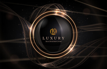 Composition with a round gold frame and a copper-colored ribbon on a black background.