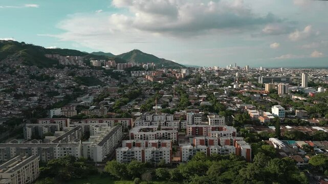 Aerial View of El Lido Tequendama Neighborhoods, Cali Colombia. Dolly Forward Shot with Three Crosses Hill in the Background