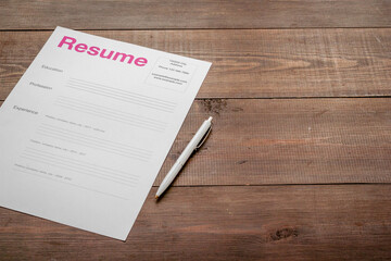 Top view of resume files on HR manager table. Reviewing resume applications. Searching for new employees