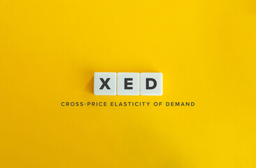 XED (Cross-Price Elasticity of Demand) Acronym and Concept Image. Text on Block Letter Tiles on...