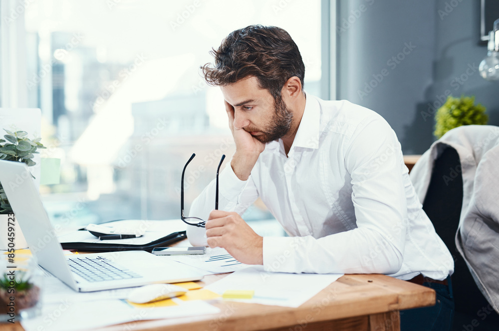 Sticker Office, laptop and man with headache by desk for tension, pain and brain fog in accounting job. Finance, business and frustrated with glasses by tech for audit information, mistake and digital review