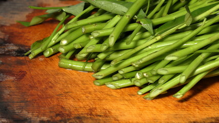 water spinach on wooden background