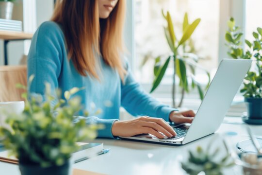 A person sitting at a desk with a laptop, ideal for office or home use scenarios