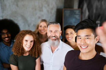Obraz premium Creative agency, selfie and team with leadership, confidence and diversity in office for cooperation. Employees, collaboration and group of people with management as small business for design work