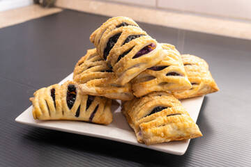 Puff pastry dough with blueberries on a black background. dessert. food concept diet