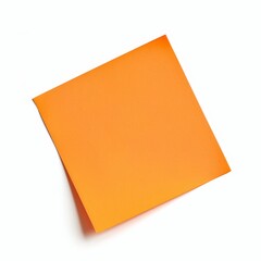 A single bright orange sticky note placed askew on a white background.
