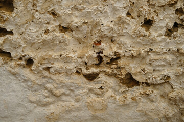 old crumbling wall, texture, historical architecture of Mediterranean cities, Cultural Heritage, deteriorating facade, weathered surface, distressed background