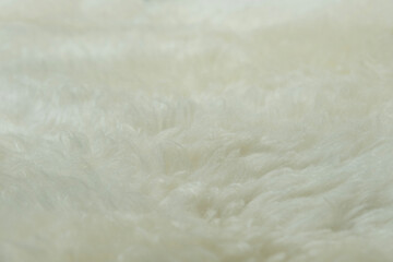 beige sheepskin texture with soft hairs, natural fur for designer, the concept of processing, production of furrier products, stress relief, psychological stress