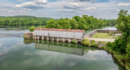 Fototapeta premium Historical dam in Savannah Rapids Park. Georgia, United States