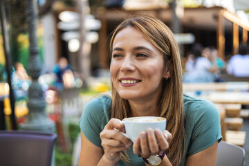 Relax, smile and woman in cafe with drink, thinking and happy customer with tea in restaurant. Latte, ideas and calm girl in coffee shop with cup, wellness or morning inspiration.