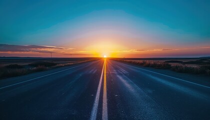 Naklejka premium A stunning sunset over an empty road stretching into the horizon, showcasing vibrant colors and peaceful, serene scenery.