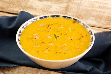 Pumpkin shredded chicken breast soup with herbs and spices