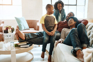 Happy, relaxing and black family on sofa in home for hugging, love and care on fathers day for celebration. Smile, bonding and African kids with mom and day resting together in living room at house.