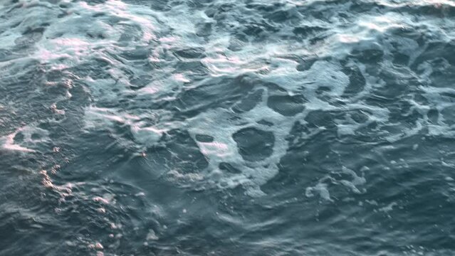 Storm on the sea. White foam on Powerful stormy wave with wind and High waves ocean. White foam on wind. Wind breaks waves. Splashes Atlantic sea