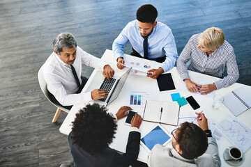 Company, meeting and graph for people, laptop and research for startup, online and top view of team. Collaboration, discussion and internet for news in boardroom, budget analyst and app for plan