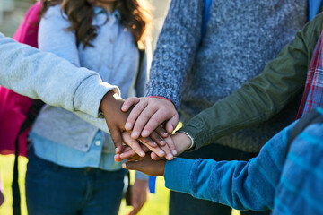 Children, hands and huddle as diversity together outdoor for youth development, support and solidarity. Kids, teamwork and friends for trust, collaboration and community as people with social bonding