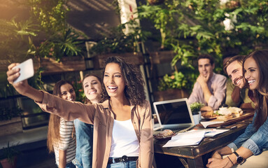 Happy people, team and cafe with selfie for memory, photography or moment in meeting at outdoor restaurant. Young group of creative employees with smile for picture, bonding or startup at coffee shop