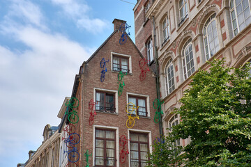 A facade of a building decorated with colorful bicycles, Brussels, Belgium