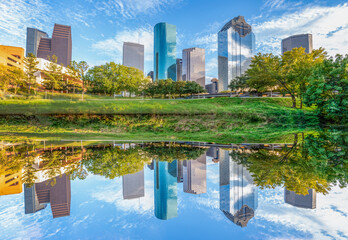 skyline of Houston, Texas in morning light seen from Buffalo bayou park and reflection in river