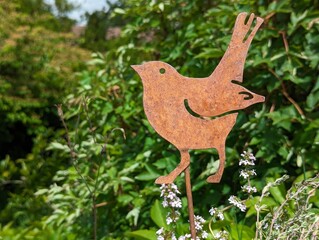 Bird Metal Decor in a Garden on a Sunny Bright Fresh Spring Day