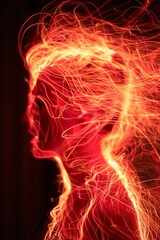 A silhouette of a man surrounded by fiery lines creating the effect of a luminous aura.