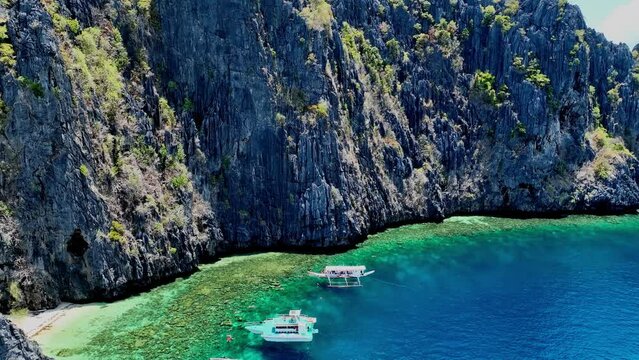 Beautiful Aerial view of One of the best island and beach destination in the world, a stunning view of rocks formation and clear water of El Nido Palawan, Philippines.	
