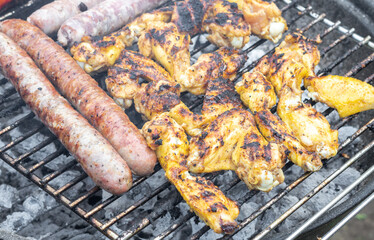 Fried sausages and grilled chicken wings.