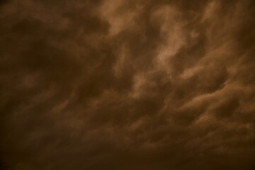 Dark clouds in the sky block out the sunlight, dramatic dark sky, impending storm