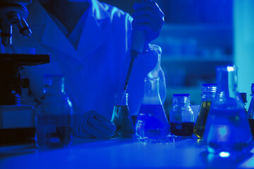 professional chemist woman laboratory using scientific microscope for science research, chemistry scientist with microbiology medicals equipment technology to working with medicine biology experiment