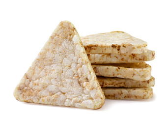 Rice crisps triangle close-up on white. Isolated
