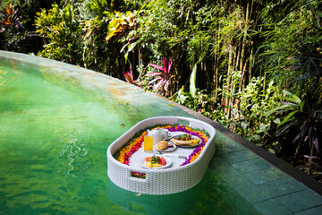 Beautiful view of  the breakfast in a swimming pool