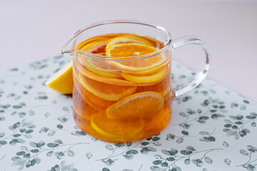 Black tea with fresh oranges