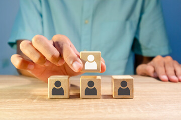 A man arranges the hierarchy of a company's business organization. Business organization hierarchy...