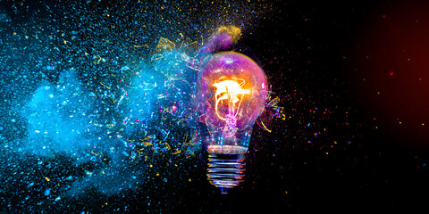 Light bulb exploding with colorful powder, Real photo