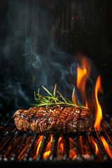 Steak meat on a stainless steel grill with flames on a dark background. Food and kitchen concept.