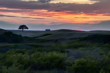 Texas hill country at sunset with a beautiful sky