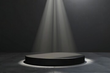 Round platform with light shining on a black background