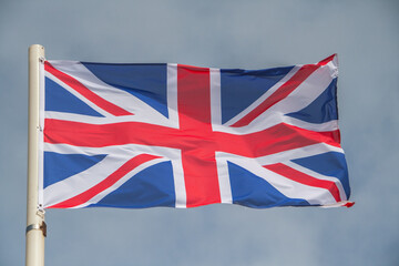 National flag of the United Kingdom. A flag ist blowing in the wind. Union Jack, Union Flag
