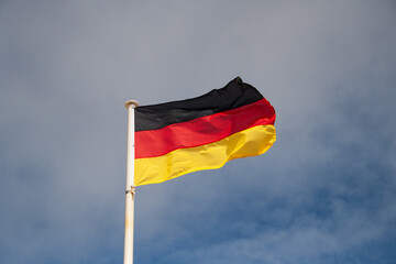 The federal flag of Germany. It consists of three horizontal stripes in black, red and gold or yellow.