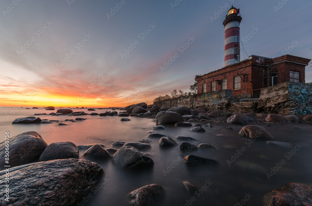 Wall mural lighthouse at sunset