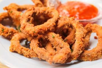 calamari rings with sauce as seafood