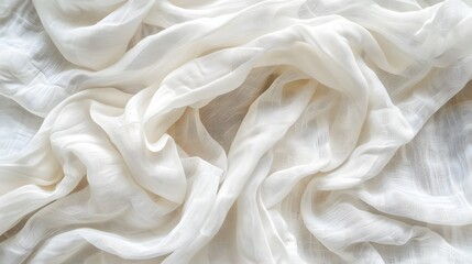 Obraz premium White crumpled linen fabric texture background. Natural off white wavy linen organic eco textiles canvas background. Top view