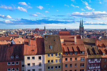 Obraz premium Top cityscape view from the castle hill on the old town with cathedral in Nurnberg, Germany
