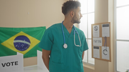 A young hispanic man in medical scrubs stands indoors in an electoral room adorned with a brazilian...