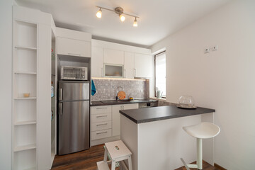 New modern kitchen. New home. Interior photography. Wooden floor.