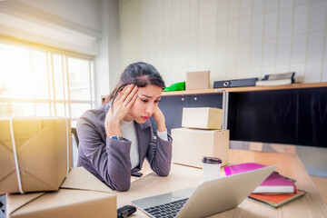 Stressed young Asian businesswoman have neck aches and pains while working in office, work hard and office syndrome concept.