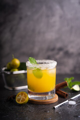 Fototapeta premium Fresh summer orange mojito with tangerine orange, mint and ice on black background