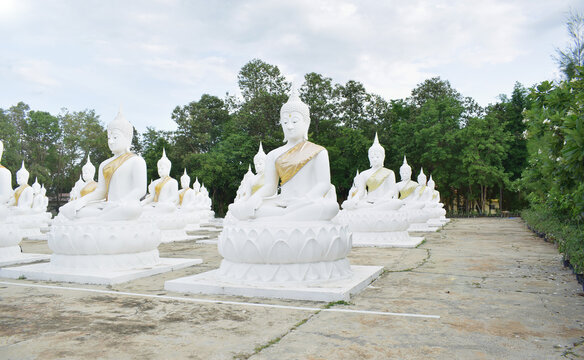 The white Buddha statue was created by a devotee for a Buddhist temple.Thailand, Khemmarat, Ubon ratchathani