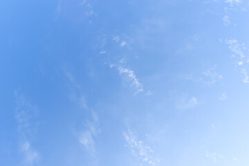 beautiful blue sky and white fluffy group of clouds with sunrise in the morning, natural background