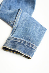 sleeve of blue denim shirt texture isolated on white background, jean fashion style